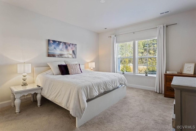 bedroom with light colored carpet