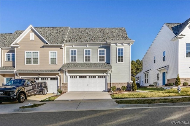 townhome / multi-family property featuring a garage