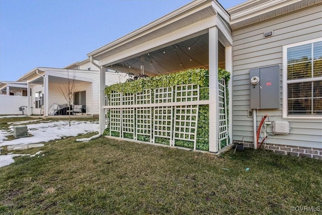 view of side of home featuring a yard