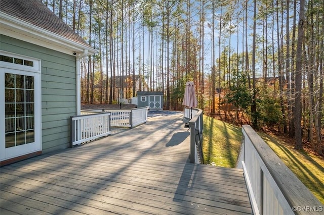 wooden terrace featuring a shed