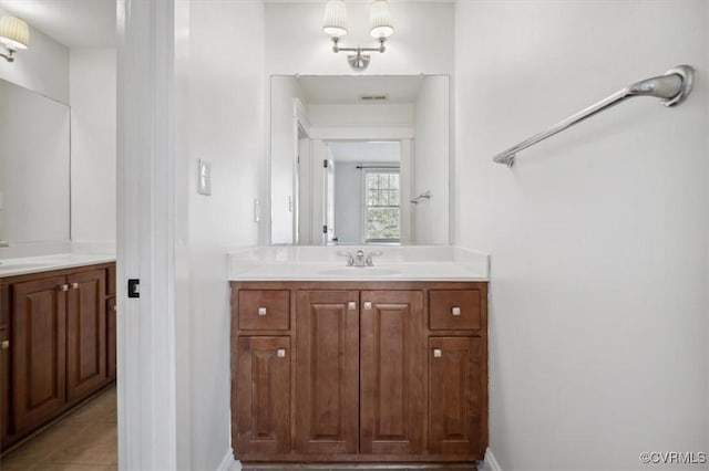 bathroom with tile patterned floors and vanity