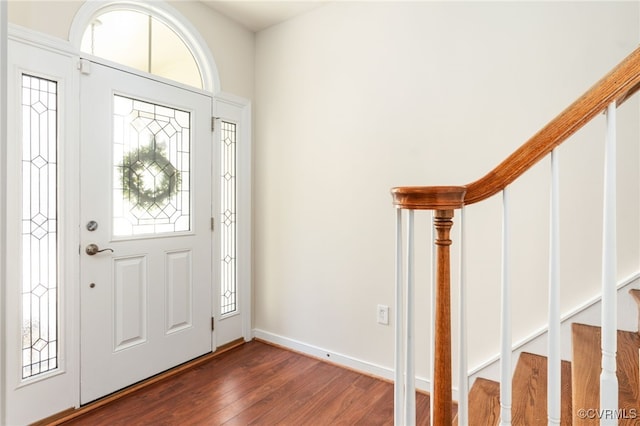 foyer with dark hardwood / wood-style floors