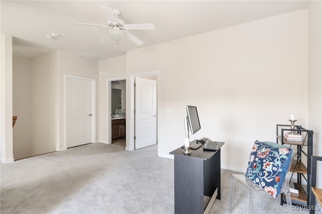 office space featuring ceiling fan and light colored carpet