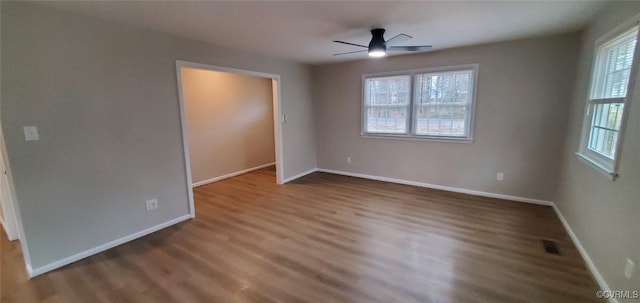 spare room featuring ceiling fan and hardwood / wood-style floors