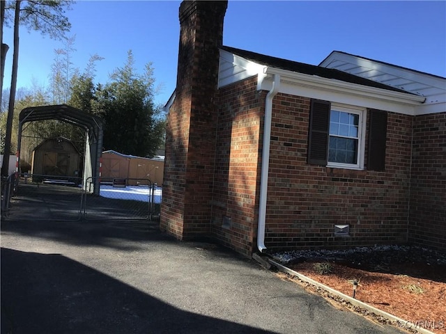 view of side of property with a storage shed