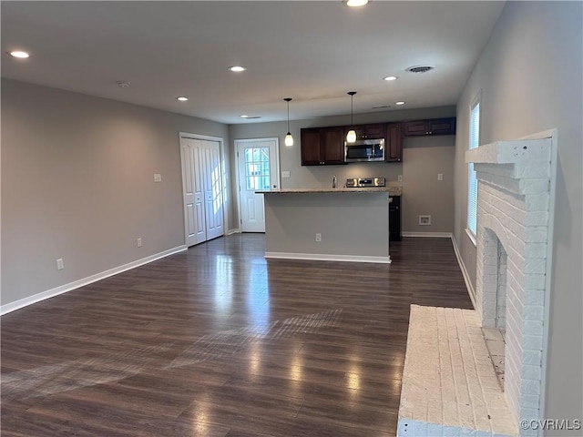 interior space with dark wood-type flooring and a fireplace