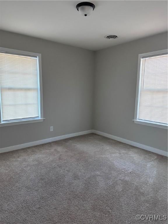 spare room with carpet floors