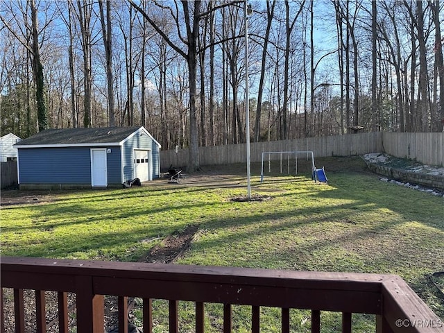 view of yard with a trampoline and a shed