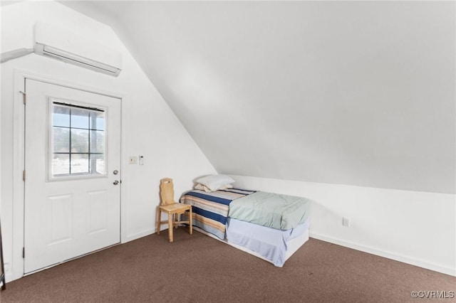 bedroom featuring dark colored carpet, a wall mounted AC, and vaulted ceiling