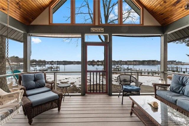 sunroom featuring wooden ceiling, lofted ceiling, and a water view