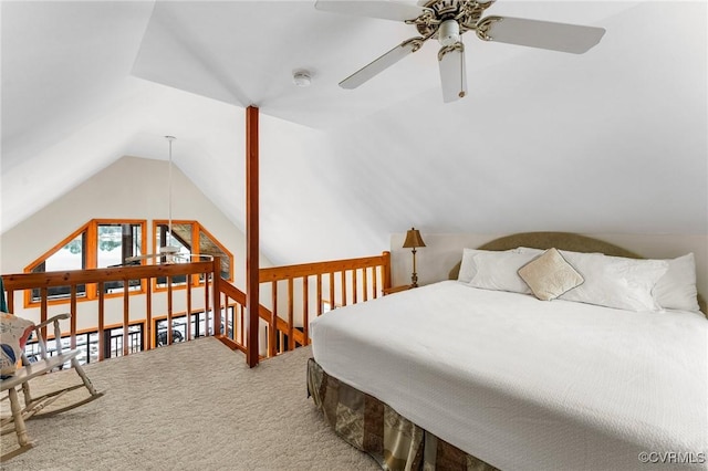 bedroom with ceiling fan, vaulted ceiling, and carpet floors