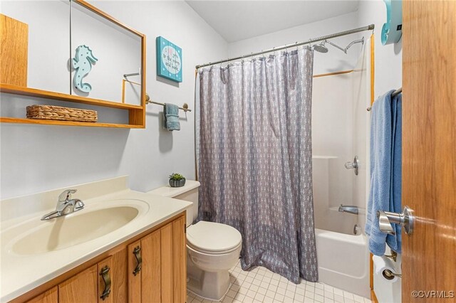 full bathroom featuring toilet, tile patterned floors, shower / bathtub combination with curtain, and vanity