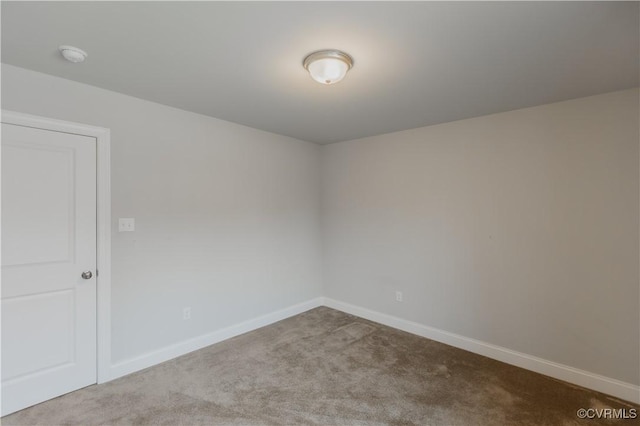 empty room with light colored carpet