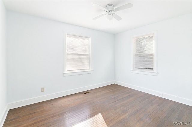 empty room featuring dark hardwood / wood-style floors and ceiling fan