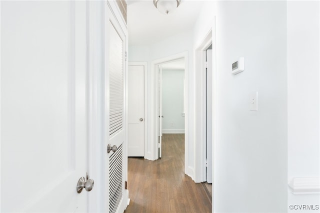 hall with dark hardwood / wood-style flooring