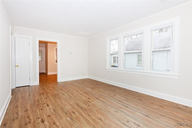 unfurnished room featuring light hardwood / wood-style floors