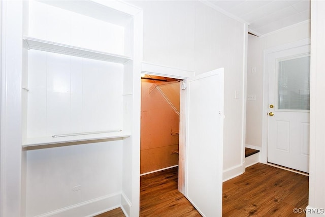 corridor with dark hardwood / wood-style flooring