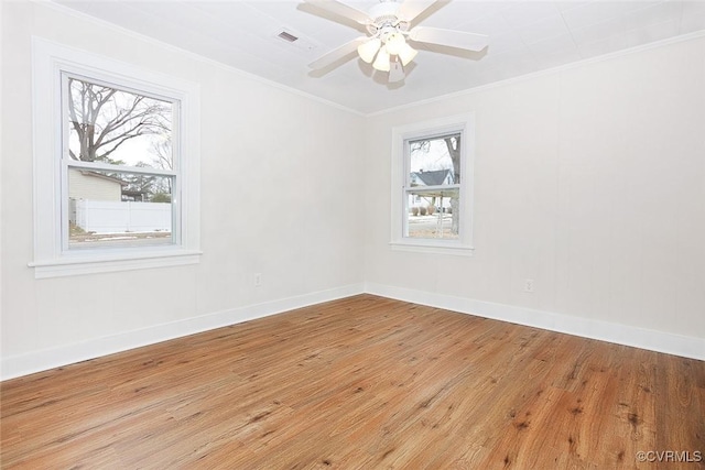 empty room with light wood-type flooring, ceiling fan, and crown molding