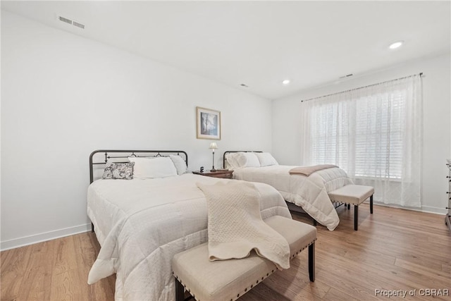 bedroom with light wood-type flooring