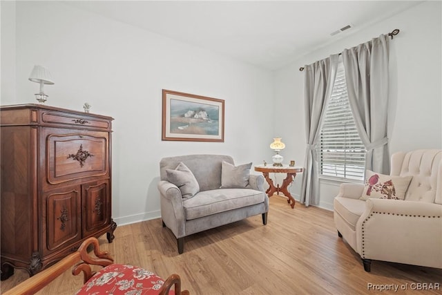 sitting room with light wood-type flooring