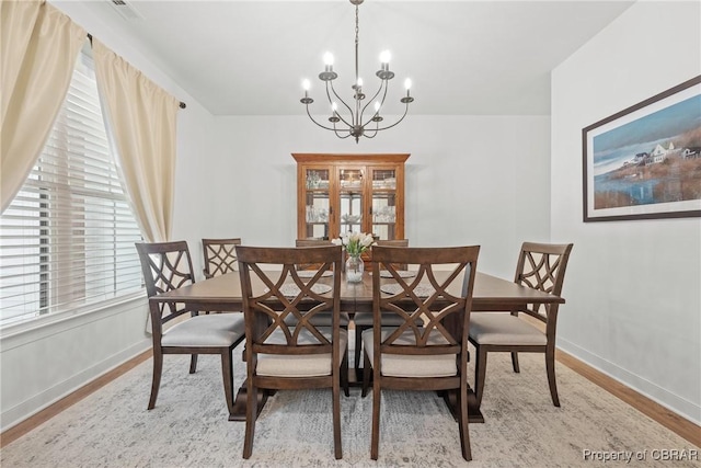 11293 Bayport Lndg, Gloucester, VA 23003 - dining area with a chandelier, wood finished floors, and baseboards