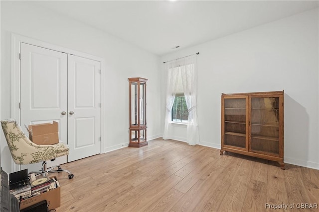 unfurnished room featuring light hardwood / wood-style floors