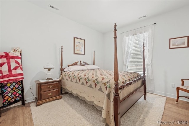 bedroom with light hardwood / wood-style floors