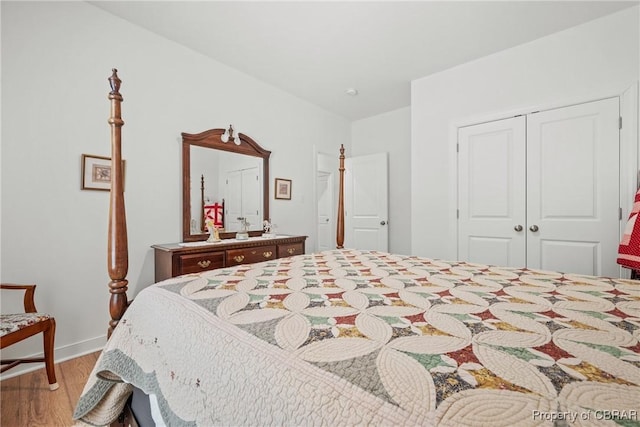 bedroom featuring a closet and light hardwood / wood-style floors