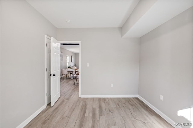 unfurnished room with light wood-type flooring