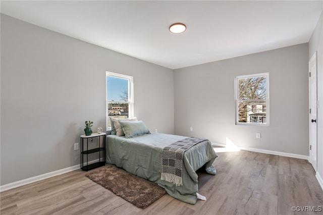 bedroom with light hardwood / wood-style floors