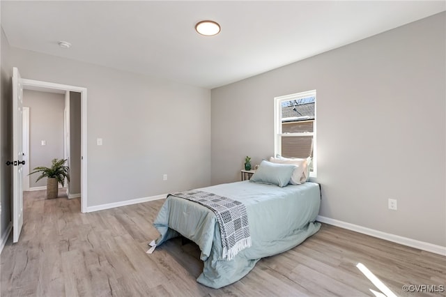 bedroom with light hardwood / wood-style flooring