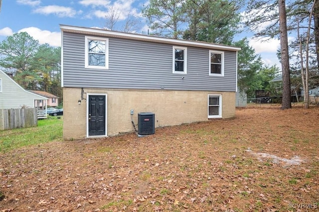 rear view of property featuring central AC