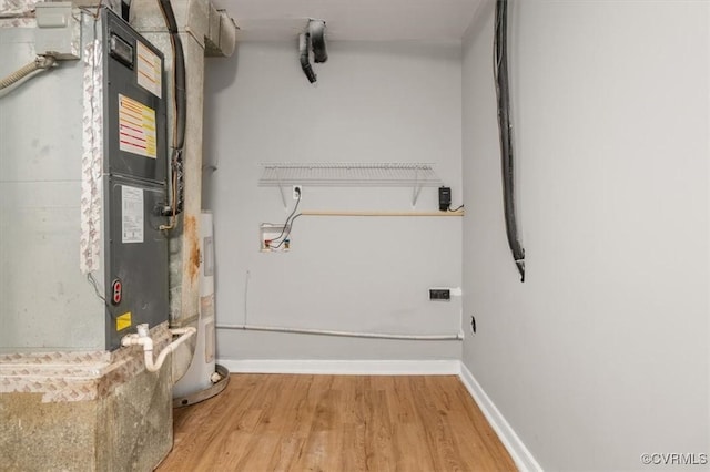 utility room with electric water heater