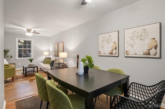 dining room featuring hardwood / wood-style flooring and ceiling fan