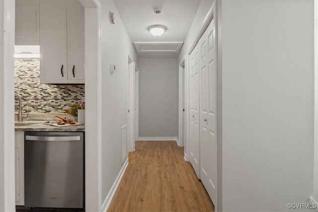 hall featuring light hardwood / wood-style floors and sink