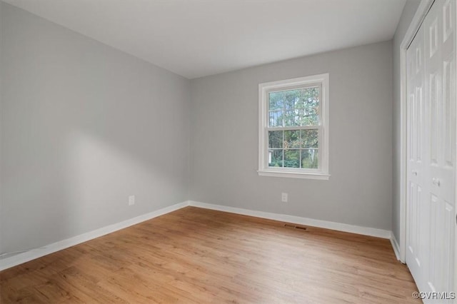 unfurnished room featuring light hardwood / wood-style flooring