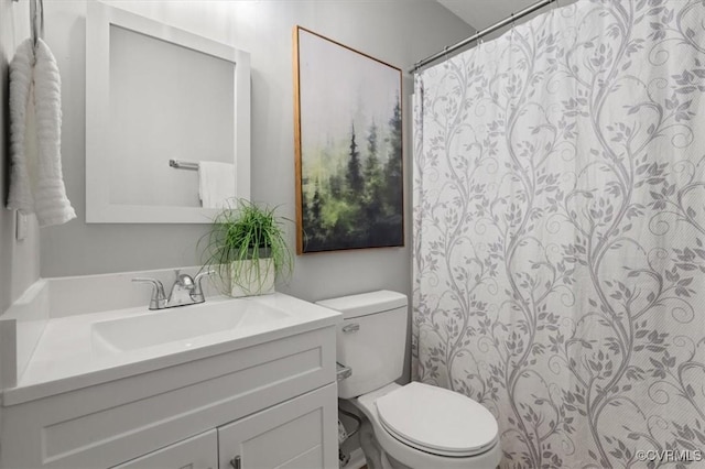 bathroom with toilet and vanity