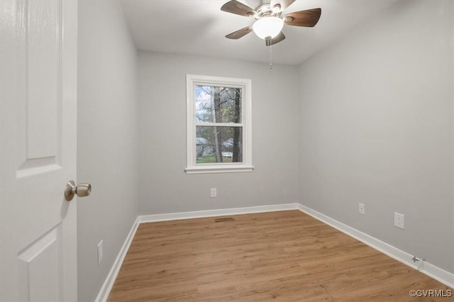 unfurnished room featuring ceiling fan and light wood-type flooring