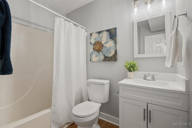 full bathroom with toilet, vanity, and shower / bath combo with shower curtain