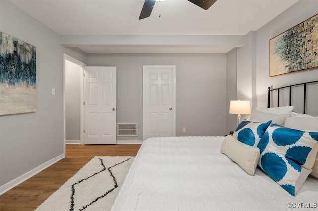 bedroom featuring ceiling fan and hardwood / wood-style floors