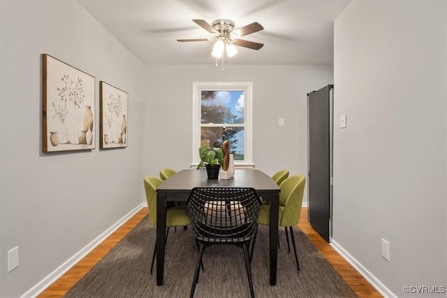 dining area featuring ceiling fan and hardwood / wood-style floors