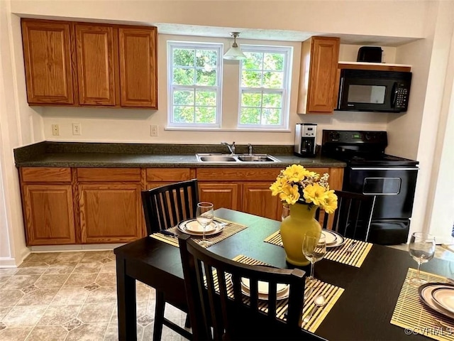 kitchen featuring sink and black appliances