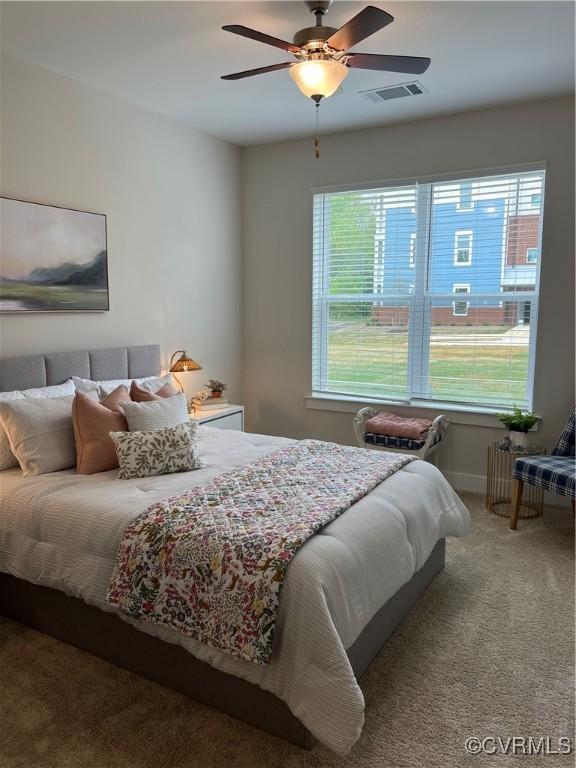 bedroom with ceiling fan and carpet floors