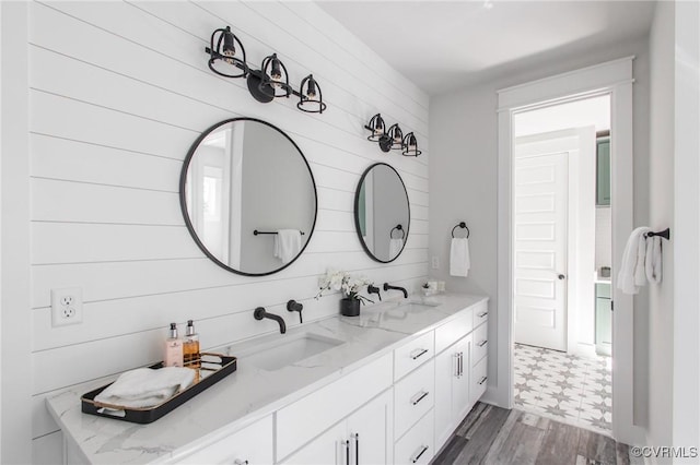 bathroom with vanity and hardwood / wood-style flooring