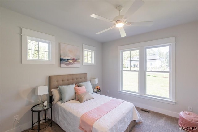 carpeted bedroom featuring ceiling fan