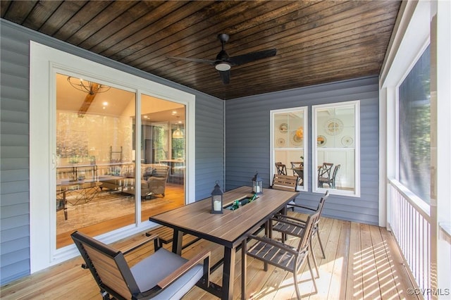 sunroom with wooden ceiling and ceiling fan