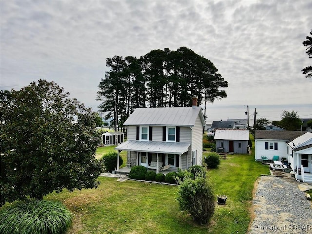 view of front of house featuring a front lawn and a porch