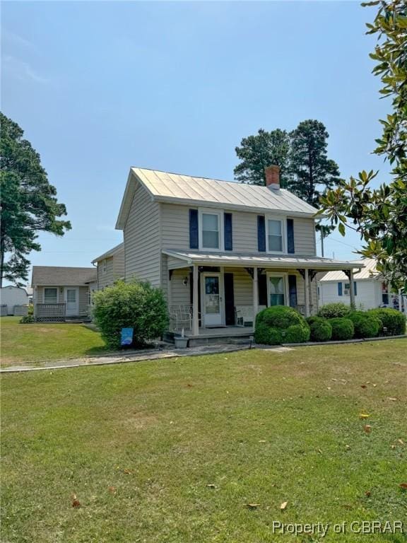 view of front of property featuring covered porch and a front yard