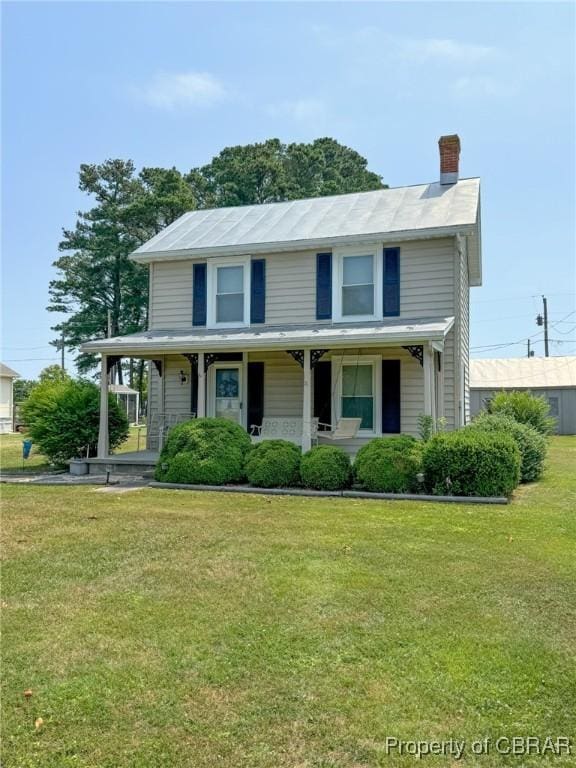 view of front of home featuring a front lawn and a porch