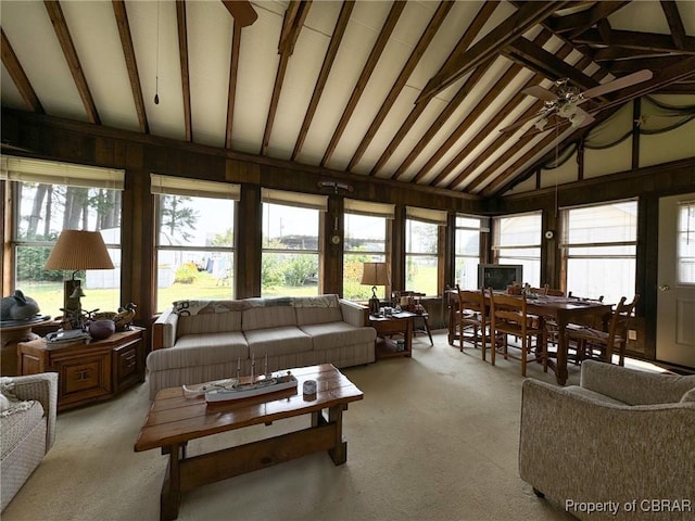 sunroom with lofted ceiling with beams